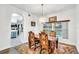 Bright dining room with hardwood floors and an arched doorway at 12711 Royal George Ave, Odessa, FL 33556