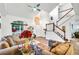 Two-story entryway with hardwood floors and elegant staircase at 12711 Royal George Ave, Odessa, FL 33556