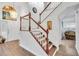 Bright entryway with elegant staircase and hardwood floors at 12711 Royal George Ave, Odessa, FL 33556