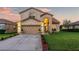 Two-story house with a landscaped yard and attached garage at 12711 Royal George Ave, Odessa, FL 33556