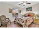 Bright bedroom with large window, hardwood floors, and comfortable seating at 12711 Royal George Ave, Odessa, FL 33556