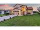 Two-story house with a landscaped yard and attached garage at 12711 Royal George Ave, Odessa, FL 33556