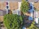 Overhead view of a single Gathering home in a residential neighborhood with a large tree at 5061 Jasmine Cir, St Petersburg, FL 33714