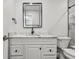 Bathroom featuring a white vanity, marble countertop, and a black faucet at 5061 Jasmine Cir, St Petersburg, FL 33714