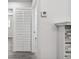 Clean hallway with white walls and a linen closet at 5061 Jasmine Cir, St Petersburg, FL 33714