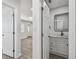 Modern bathroom with white vanity, marble countertop, and black fixtures at 5061 Jasmine Cir, St Petersburg, FL 33714