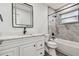 Updated bathroom with marble tile shower and bathtub at 5061 Jasmine Cir, St Petersburg, FL 33714