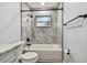 Clean bathroom with white vanity, marble countertop, and black accents at 5061 Jasmine Cir, St Petersburg, FL 33714