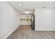 Open concept dining room with wood-look floors and kitchen view at 5061 Jasmine Cir, St Petersburg, FL 33714