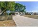 Updated home with a large driveway and mature trees at 5061 Jasmine Cir, St Petersburg, FL 33714