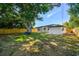 Spacious backyard with large tree and seating at 5061 Jasmine Cir, St Petersburg, FL 33714