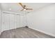 Bedroom with ceiling fan, window, and double closets at 5061 Jasmine Cir, St Petersburg, FL 33714
