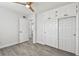 Spacious bedroom with wood-look floors, and door to another room at 5061 Jasmine Cir, St Petersburg, FL 33714