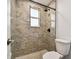 Bathroom with large shower and marble-look tile at 5061 Jasmine Cir, St Petersburg, FL 33714