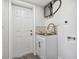Bright laundry room with sink and cabinets at 5061 Jasmine Cir, St Petersburg, FL 33714