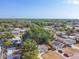 Aerial view of a house with mature trees and surrounding homes in a residential neighborhood at 5061 Jasmine Cir, St Petersburg, FL 33714