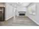 Living room with fireplace and wood-look flooring at 5061 Jasmine Cir, St Petersburg, FL 33714