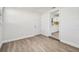 Bright dining room features wood-look floors and an open view to the kitchen at 5061 Jasmine Cir, St Petersburg, FL 33714
