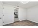 Bright dining room with wood-look floors and kitchen access at 5061 Jasmine Cir, St Petersburg, FL 33714