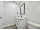Simple bathroom with a white vanity and marble countertop at 5061 Jasmine Cir, St Petersburg, FL 33714