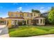 Two story yellow brick home with a large yard at 803 Bayshore Blvd, Tampa, FL 33606