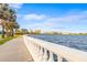 Scenic waterfront path with balustrade and city skyline view at 803 Bayshore Blvd, Tampa, FL 33606