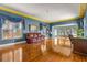 Spacious living room with hardwood floors, leather couch, and home office at 803 Bayshore Blvd, Tampa, FL 33606