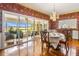 Elegant dining room with floral wallpaper, chandelier, and access to a sunroom at 803 Bayshore Blvd, Tampa, FL 33606