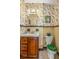 Small bathroom with vintage vanity and tropical wallpaper at 803 Bayshore Blvd, Tampa, FL 33606