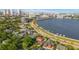 Aerial view of a house with a pool near the water and city skyline at 803 Bayshore Blvd, Tampa, FL 33606