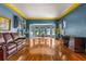 Spacious living room with hardwood floors, leather couch, and home office at 803 Bayshore Blvd, Tampa, FL 33606