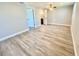 Spacious bedroom with wood-look floors and an ensuite bathroom at 8147 Chesebro Ave, North Port, FL 34287