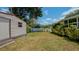Large backyard with shed and lush landscaping at 1702 Blind Pond Ave, Lutz, FL 33549
