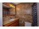 Bathroom with granite vanity and tiled shower at 1702 Blind Pond Ave, Lutz, FL 33549