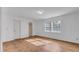 Spacious bedroom with tile floors and a large window at 1702 Blind Pond Ave, Lutz, FL 33549