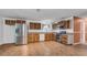 Kitchen with stainless steel appliances and wood cabinets at 1702 Blind Pond Ave, Lutz, FL 33549
