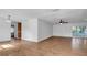 Large living room with tile floors and access to other rooms at 1702 Blind Pond Ave, Lutz, FL 33549