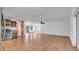 Open living and kitchen area with tile floors and ceiling fan at 1702 Blind Pond Ave, Lutz, FL 33549