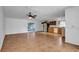 Open living and kitchen area with tile floors and ceiling fan at 1702 Blind Pond Ave, Lutz, FL 33549
