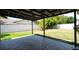Covered patio with brick pavers and backyard view at 1702 Blind Pond Ave, Lutz, FL 33549