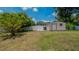 Spacious backyard with storage shed and lush green grass at 1702 Blind Pond Ave, Lutz, FL 33549