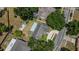 Aerial view of house showing the backyard, shed and surrounding houses at 1702 Blind Pond Ave, Lutz, FL 33549