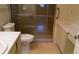 Bathroom with walk-in shower and built-in vanity at 6263 Green View Cir # 107, Sarasota, FL 34231