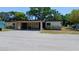Front view of condo with carport and landscaping at 6263 Green View Cir # 107, Sarasota, FL 34231