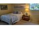 Bright bedroom with double bed and nightstand at 6263 Green View Cir # 107, Sarasota, FL 34231