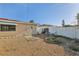 Enclosed backyard featuring neutral gravel landscaping, a white privacy fence, and planting area at 186 45Th Ave, St Pete Beach, FL 33706