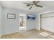 A bedroom featuring a ceiling fan and a doorway leading to an adjacent space or bathroom at 186 45Th Ave, St Pete Beach, FL 33706