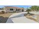 Beautiful single-story home featuring a red tile roof, stucco facade, an attached garage, and a spacious concrete driveway at 186 45Th Ave, St Pete Beach, FL 33706