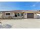 Charming single-story home featuring a red tile roof, stucco facade, an attached garage, and a spacious concrete driveway at 186 45Th Ave, St Pete Beach, FL 33706