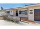 Charming single-story home with red tile roof and stucco walls featuring an attached garage and a quaint courtyard entry at 186 45Th Ave, St Pete Beach, FL 33706